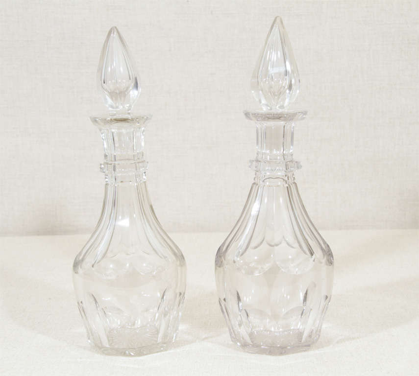 Pair of Victorian Cut Glass Decanters with Flame Motif Stoppers.  England, Mid 19th Century.<br />
<br />
12 inches high x 4 inches diameter